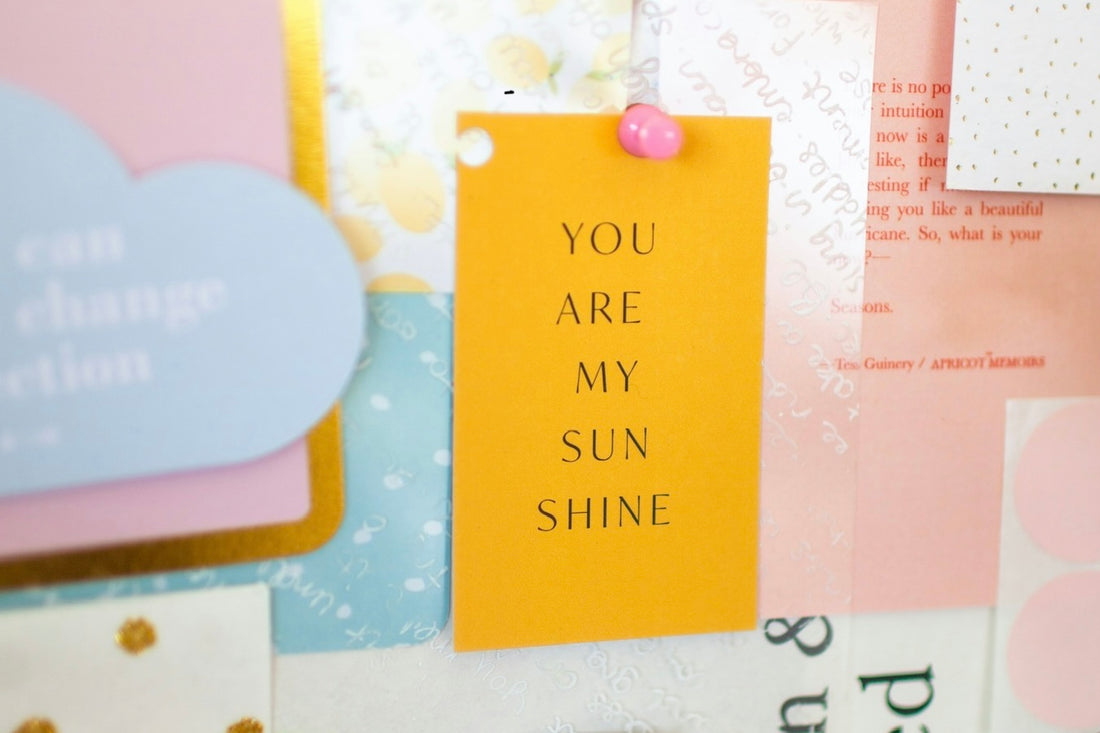 happy mail 'you are my sunshine' yellow postcard pinned to noticeboard