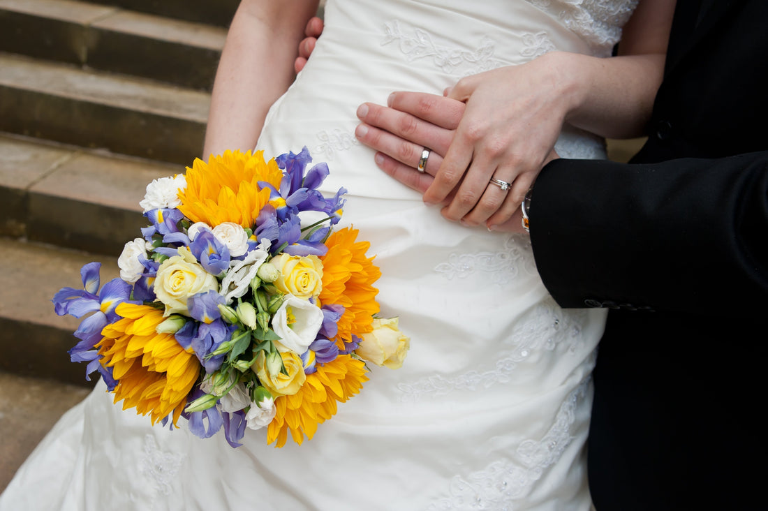 Christian wedding bride and groom with lilac and yellow bouquet