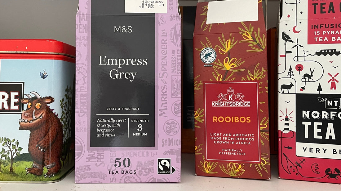 boxes of tea lined up on a shelf