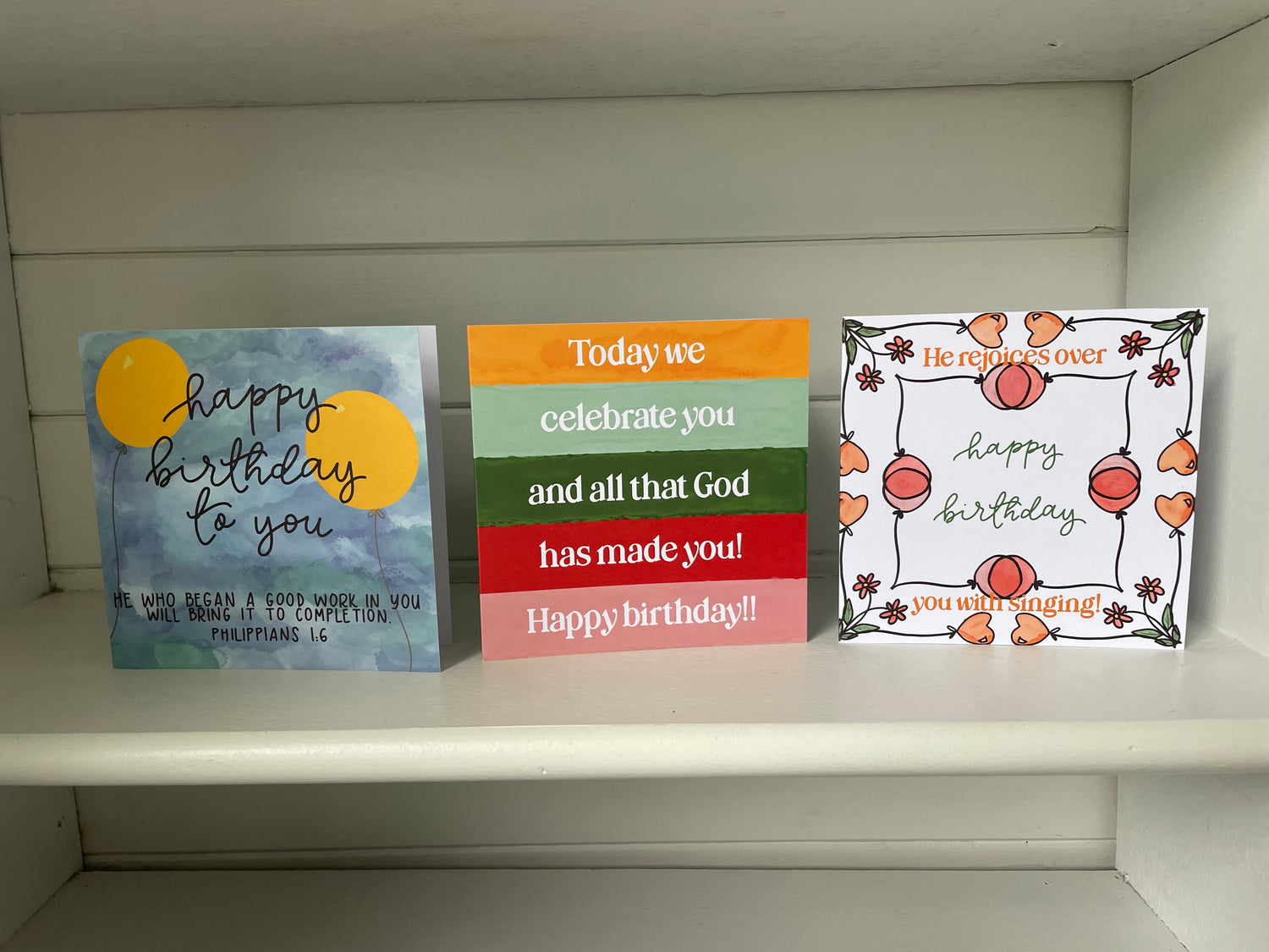 Shelf with three Christian birthday cards, with lovely bright colours and biblical affirmations.