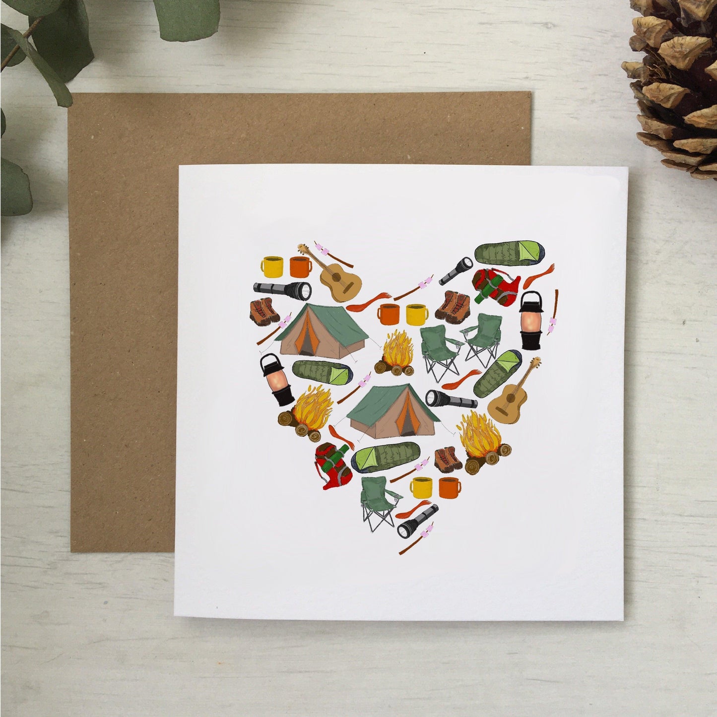 camping themed greeting card with illustrated camping items in a heart shape