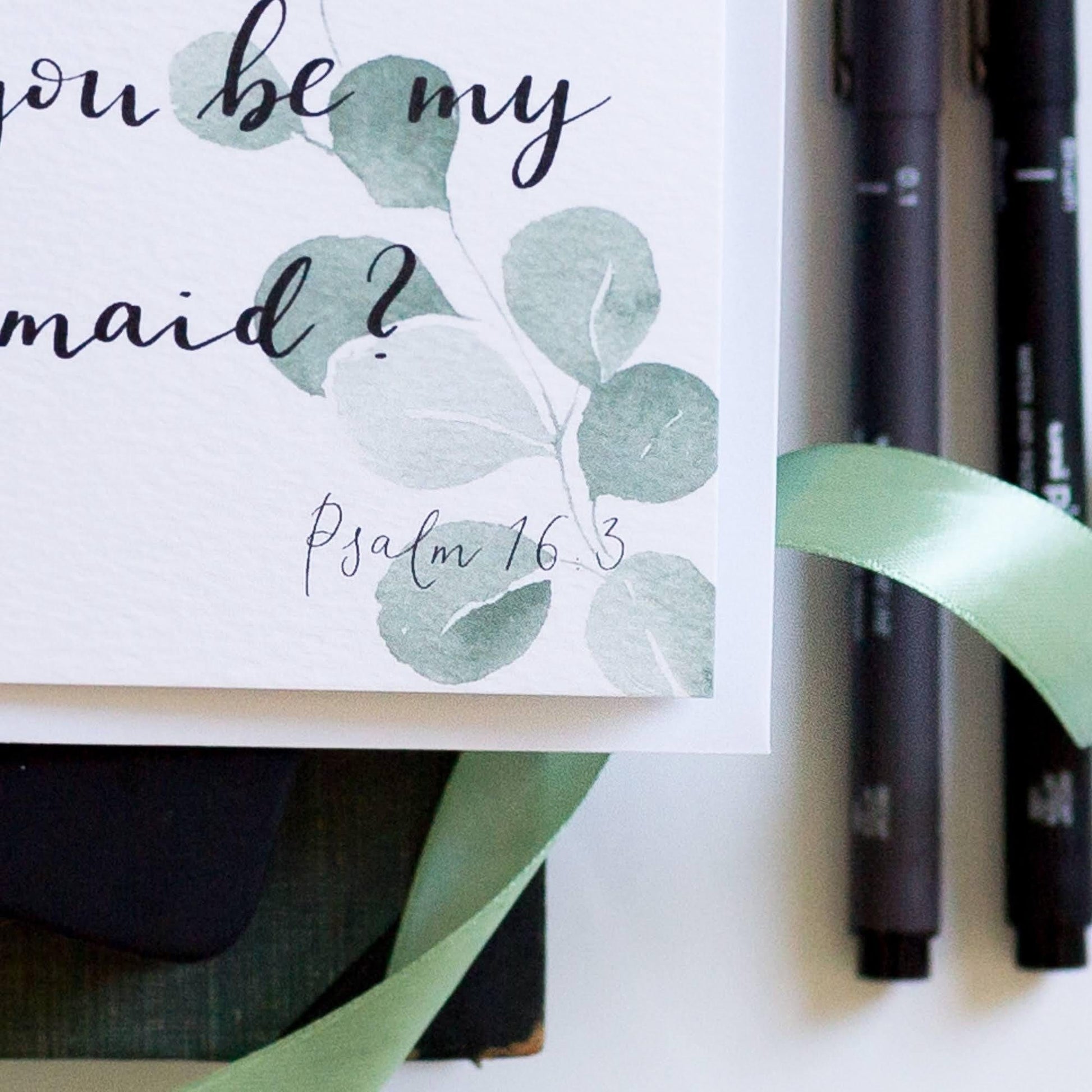 Close up of psalm 16:3 in the corner of the bridesmaid proposal card