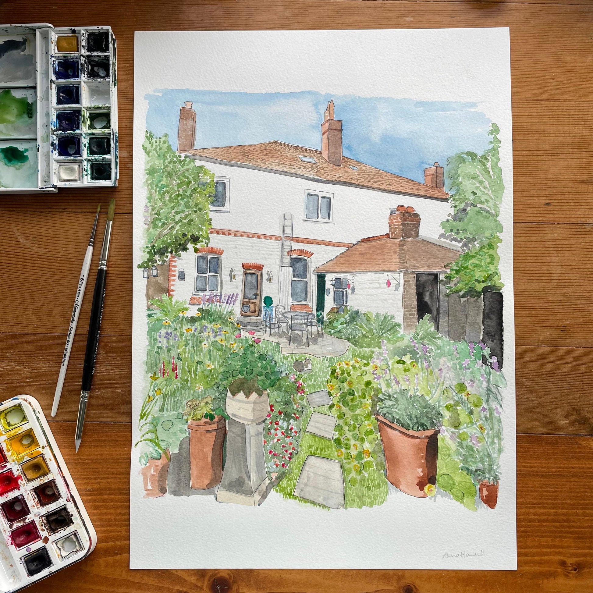 Commissioned watercolour house portrait including back garden and colourful flowers for birthday gift.