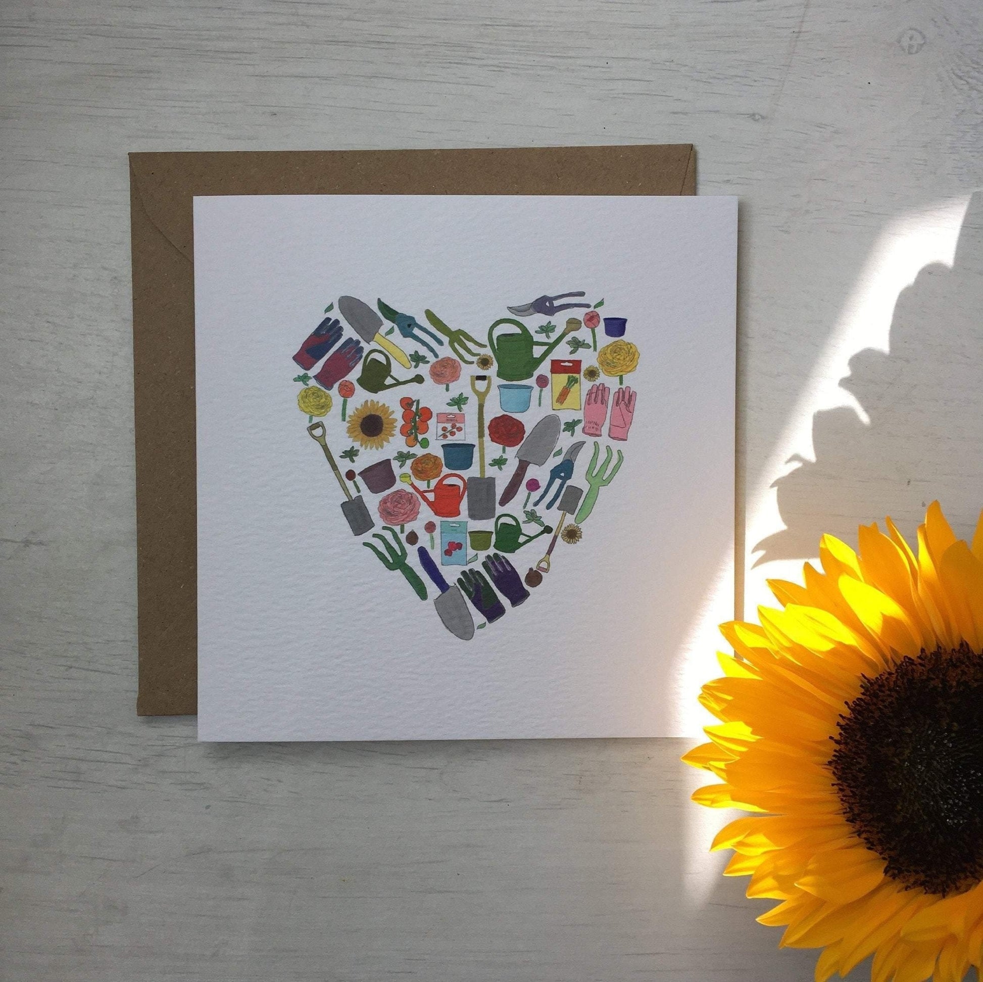 Luxury printed garden theme card with lots of gardening things all displayed in the shape of a heart